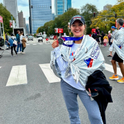 Lincoln Park Member holding medal after Chicago marathon.