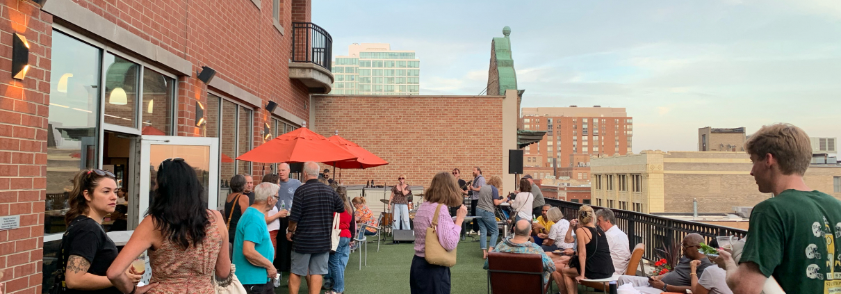Members hanging out on the outdoor Sundeck at Best Gym in Oak Park.