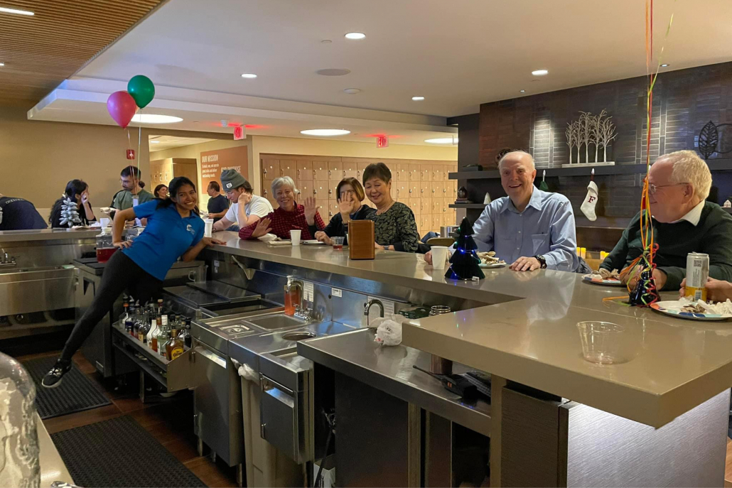 Members enjoying drinks at the club lounge bar at Elmhurst Gym.