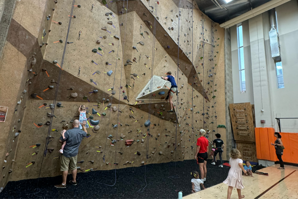 Kids practicing on the indoor climbing wall at Best Gym in Oak Park.