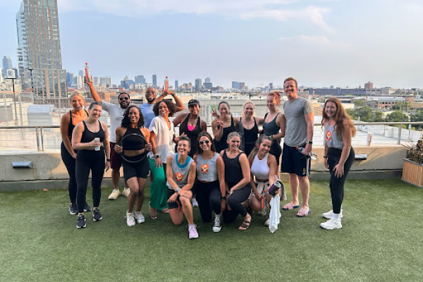 Pilates Mat participants after class on turf at Best gym in Lincoln Park.