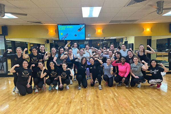 Group Fitness Class participants flexing in the studio at Old Town Chicago gym.