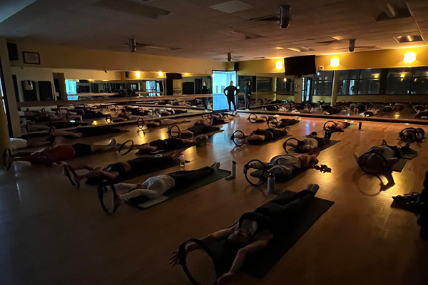 Pilates Mat group fitness class at Old Town Chicago gym.