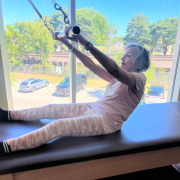 Member performing a Pilates exercise.