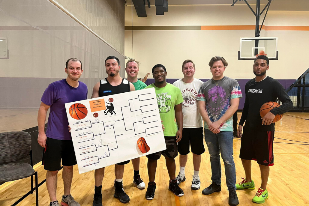 Basketball tournament players with bracket at Best Gym in downtown Chicago.