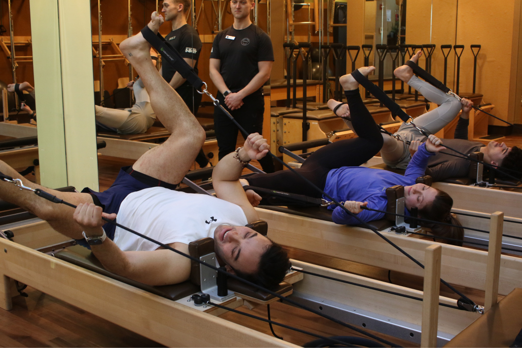 Group reformer class in the Pilates studio at West Loop gym.