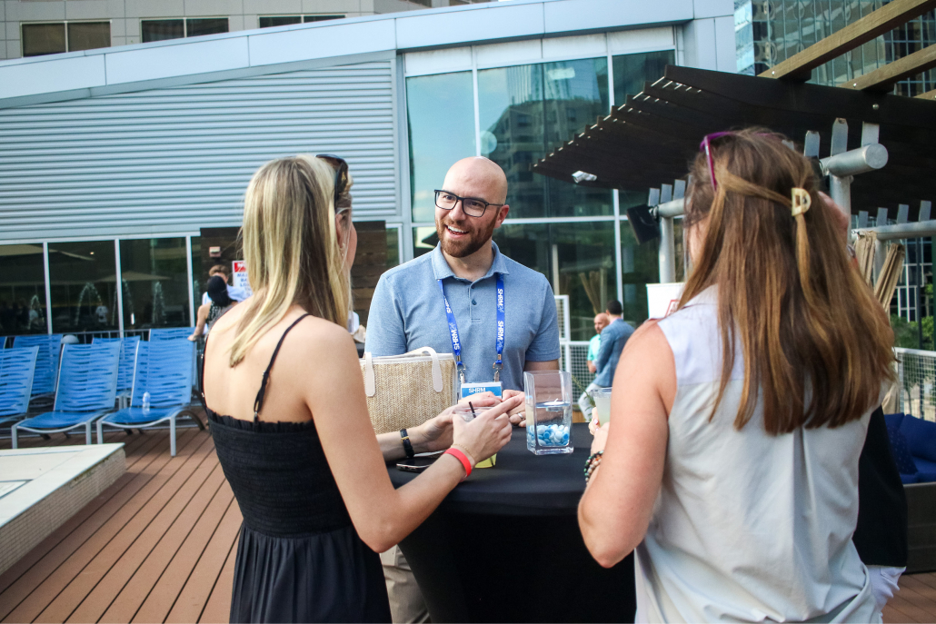 Member happy hour social on the outdoor pool deck and splash bar.