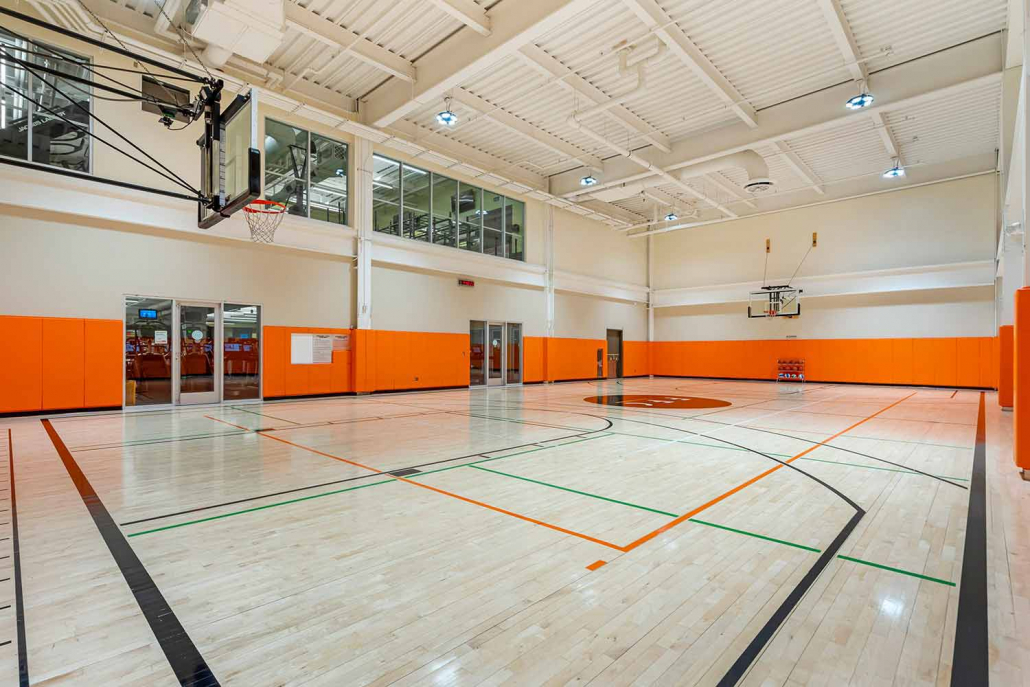 Basketball court with pickleball courts inside Elmhurst Gym.