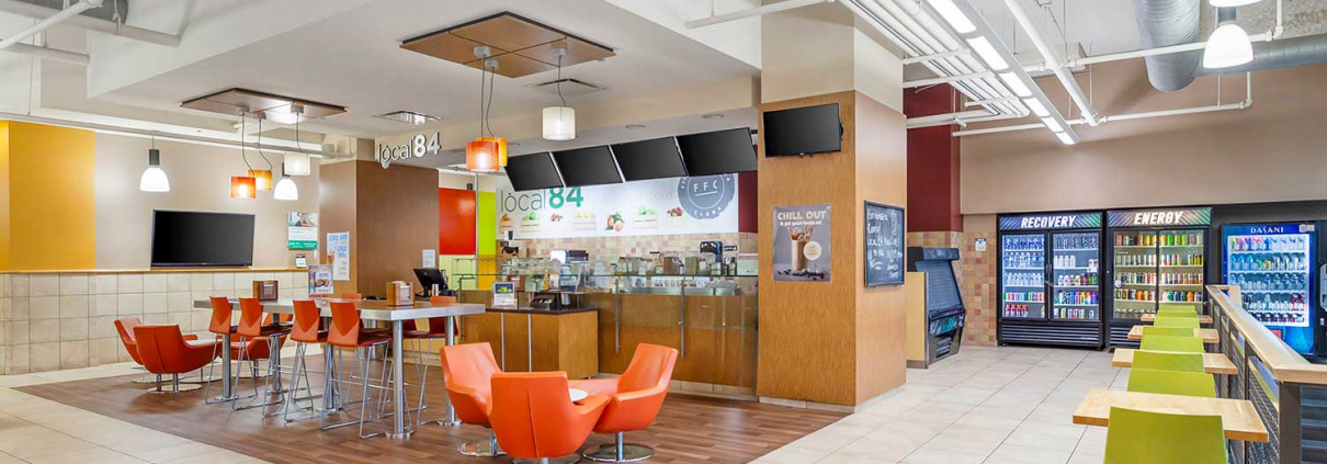 Club Lounge and Cafe with Full-Service Bar, and Seating Area inside Oak Par Gym.