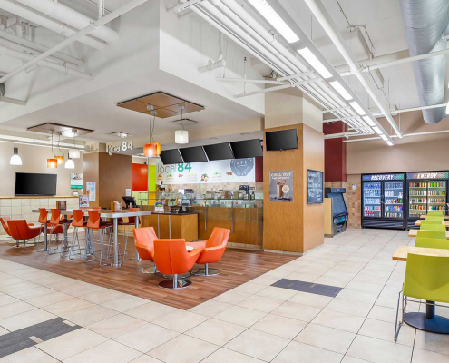 Club Lounge and Cafe with Full-Service Bar, and Seating Area inside Oak Par Gym.