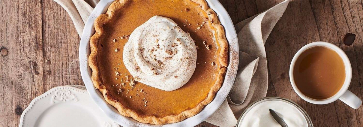 A pumpkin pie on a table