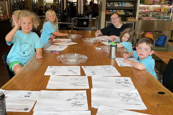 Kids coloring in the cafe at gym with child care