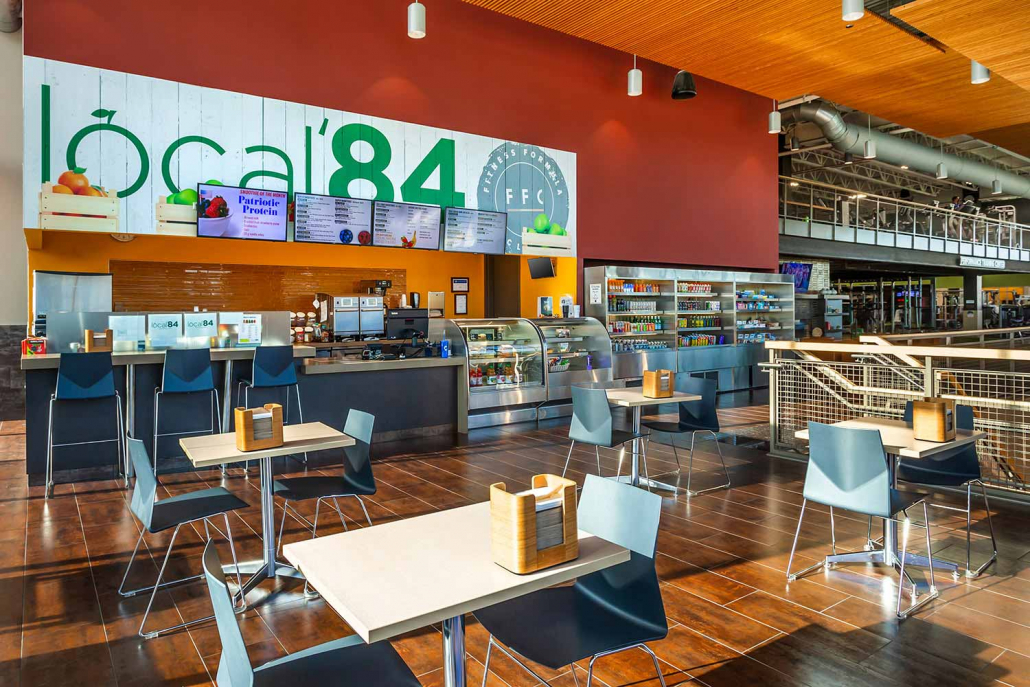 Cafe with full-service bar, and seating area inside Park Ridge Gym.