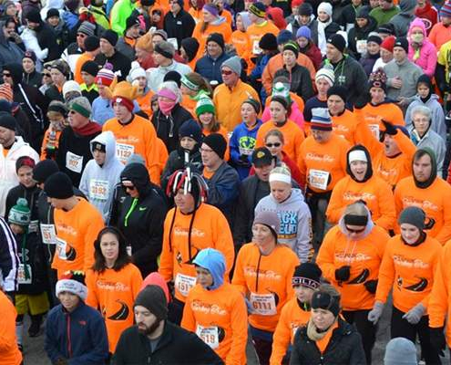 A group of runners participating in a turkey trot