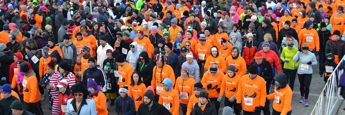 A group of runners participating in a turkey trot