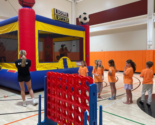 Kids club at FFC Park Ridge. Kids waiting in line for the bouncy house
