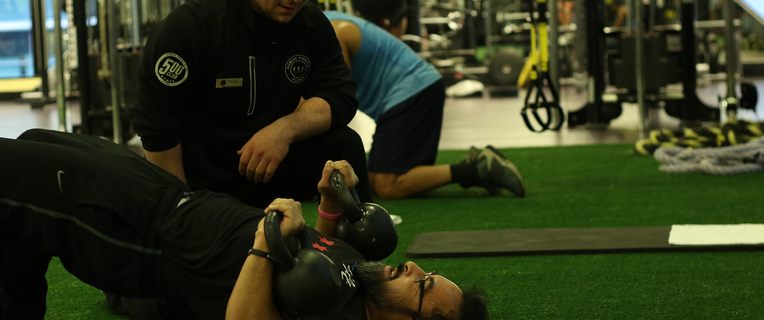 Personal Trainer assisting client at FFC Union Station