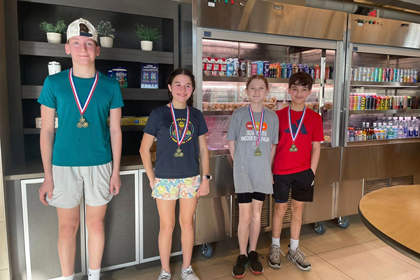 FFC Park Ridge members wearing Gold Medals for the kids indoor triathlon.