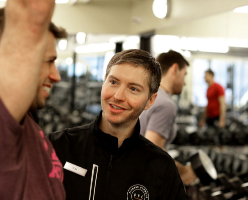 A personal trainer training his client